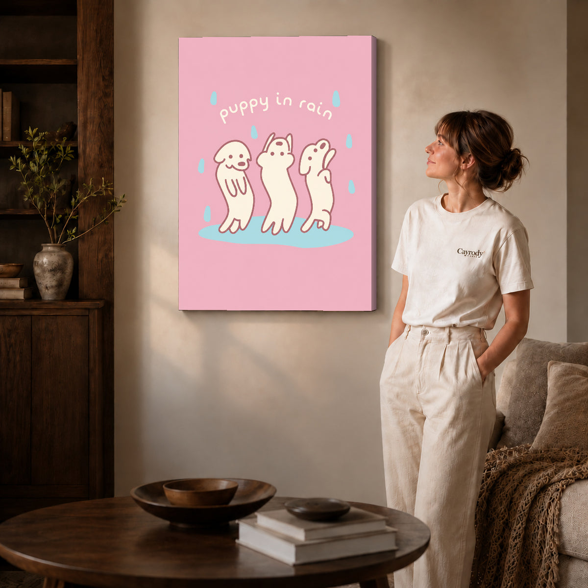 rain dancing puppies canvas art on gallery-wrapped canvas with natural edge shading beside a standing woman.