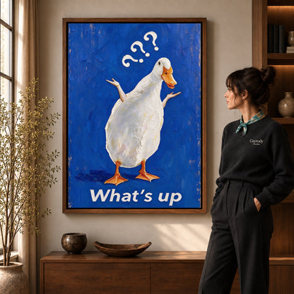 curious shrugging duck canvas art shown in the walnut frame option within a warm living room.
