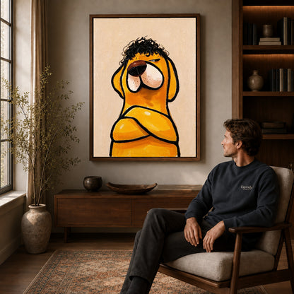 curly haired dog canvas art in a walnut frame above a console beside a seated man.