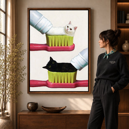 toothpaste kitten duo canvas art shown in the walnut frame option within a warm living room.