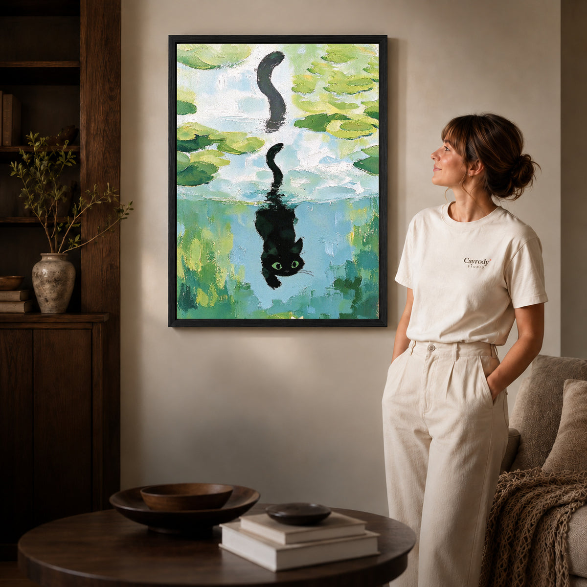 lily pond reflection canvas art shown in the black frame option against a softly lit wall.