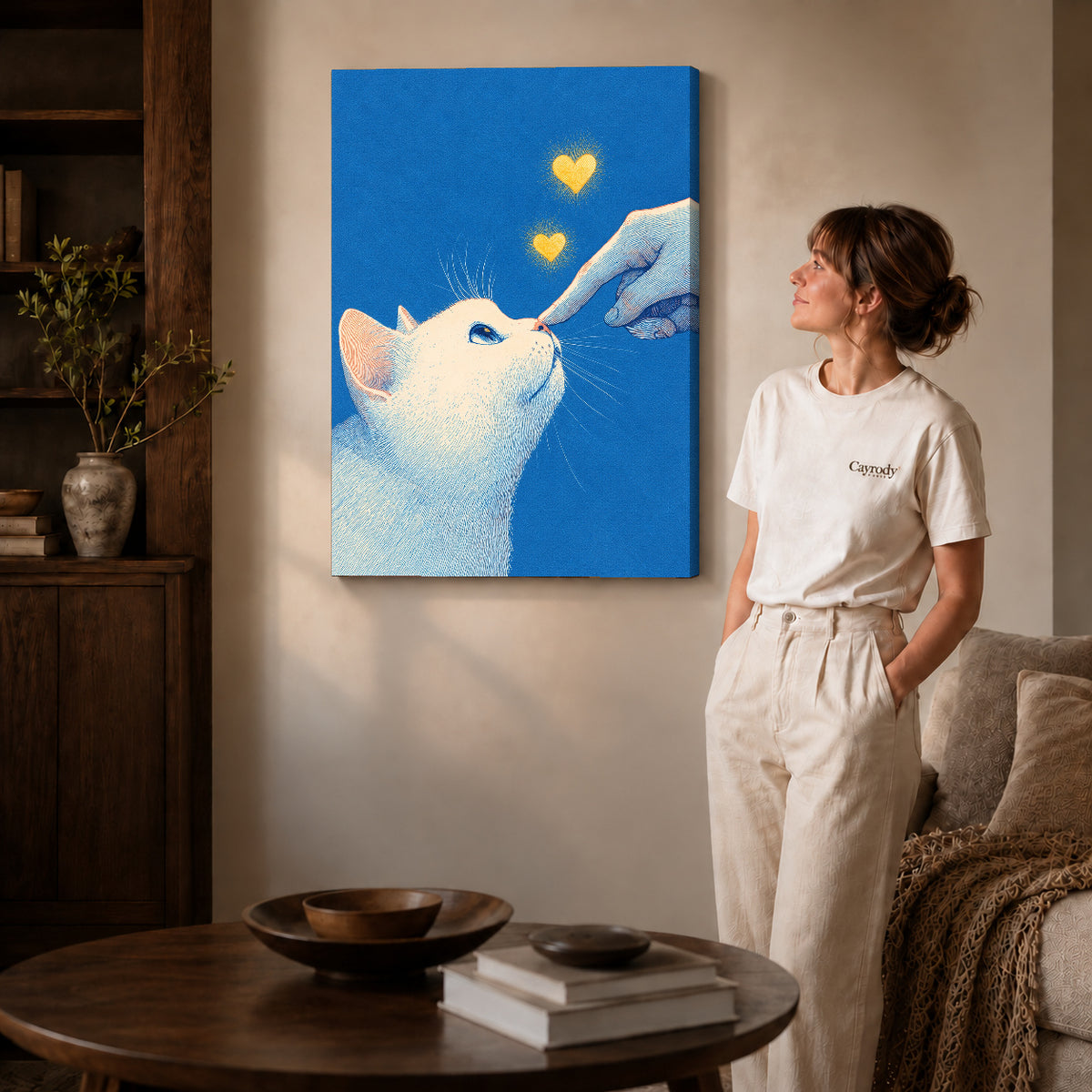 gentle cat greeting canvas art on gallery-wrapped canvas with natural edge shading beside a standing woman.