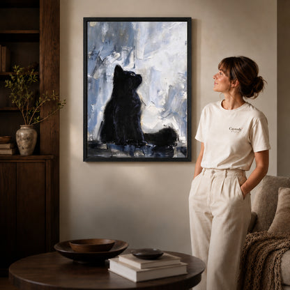 quiet black kitten canvas art shown in the black frame option against a softly lit wall.