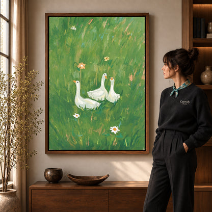 meadow goose trio canvas art in a walnut frame beside a standing woman and wooden console.