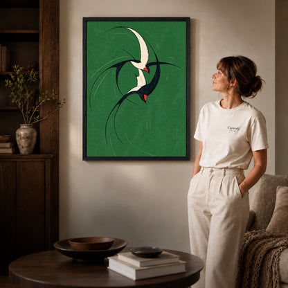 graceful swallow pair canvas art shown in the black frame option against a softly lit wall.