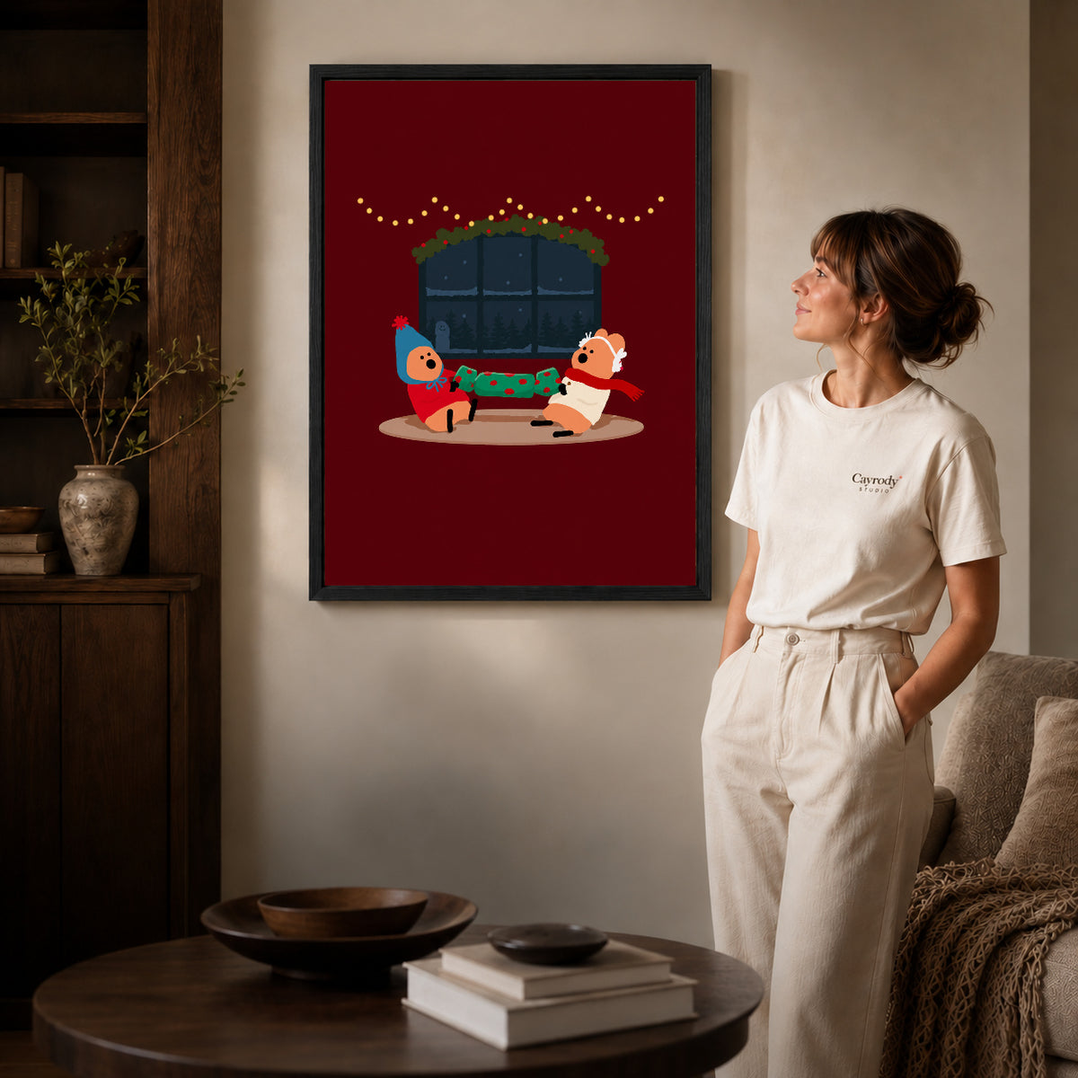 christmas cracker friends canvas art shown in the black frame option against a softly lit wall.