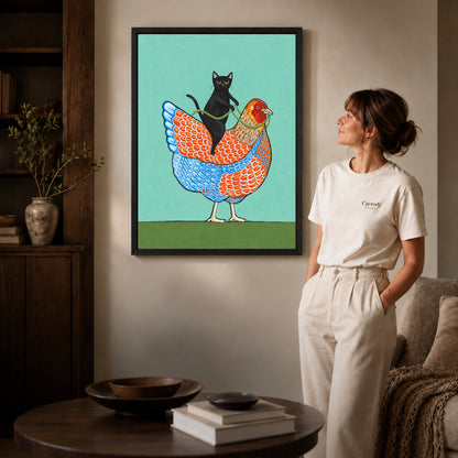 cat riding hen canvas art shown in the black frame option against a softly lit wall.