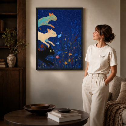 starry meadow cats canvas art shown in the black frame option against a softly lit wall.
