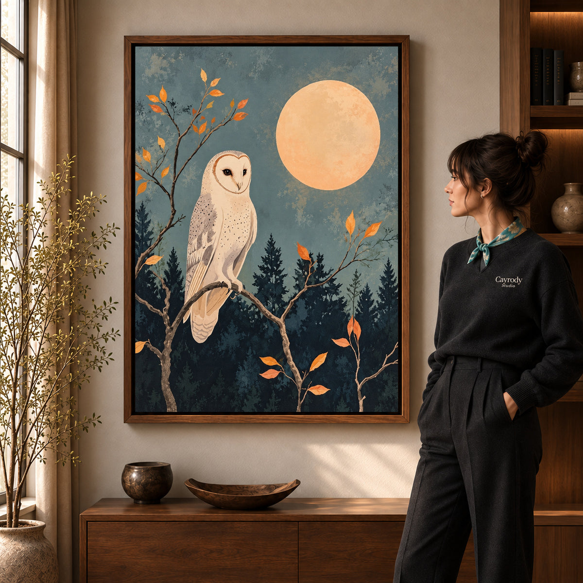 moonlit barn owl canvas art shown in the walnut frame option within a warm living room.