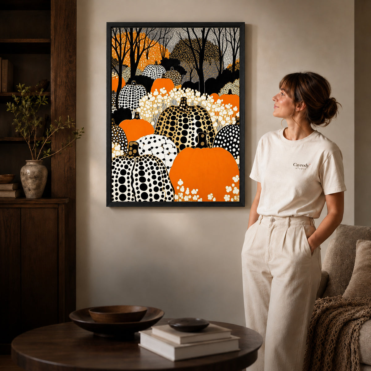 patterned pumpkin woods canvas art shown in the black frame option against a softly lit wall.