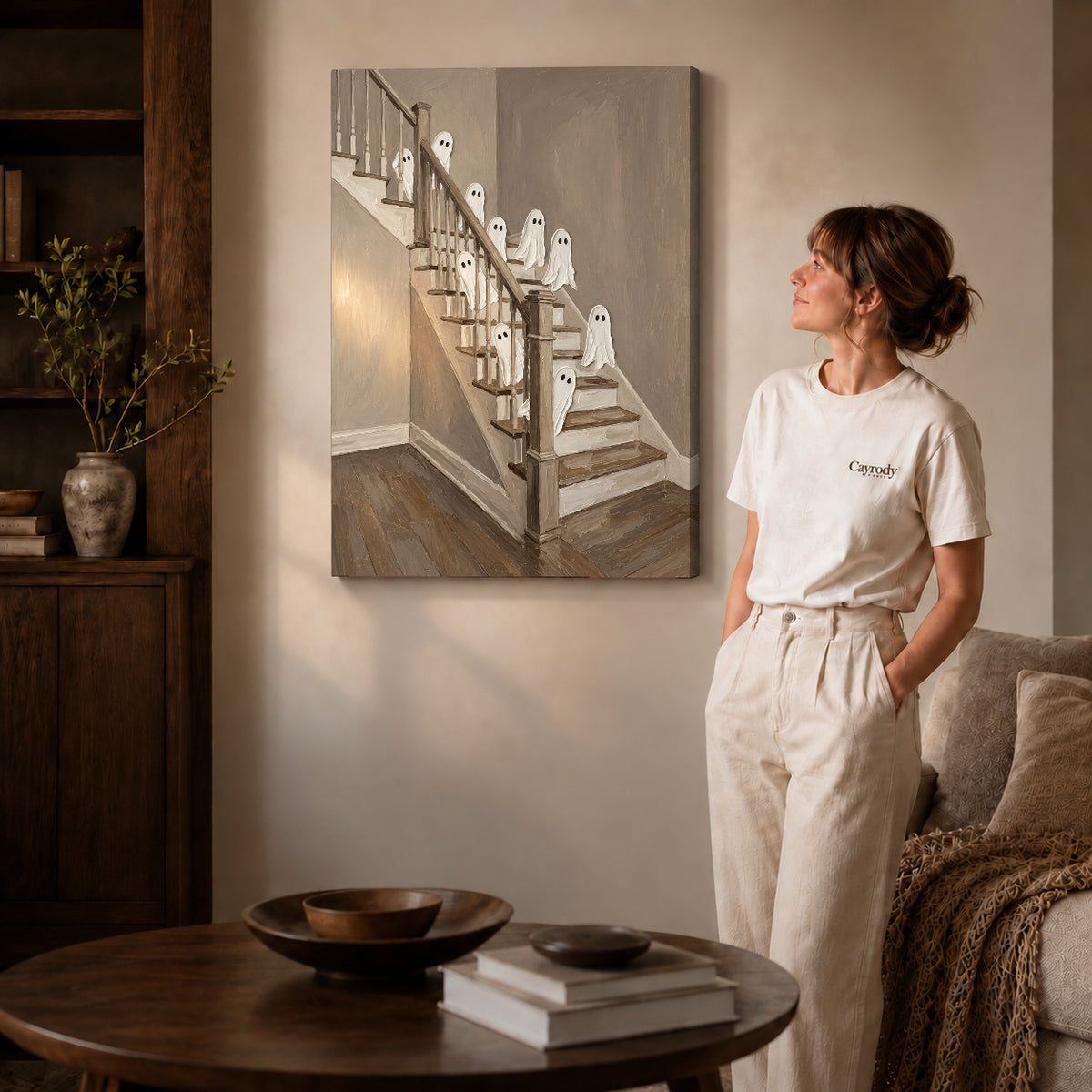 staircase ghost gathering canvas art on gallery-wrapped canvas with natural edge shading beside a standing woman.