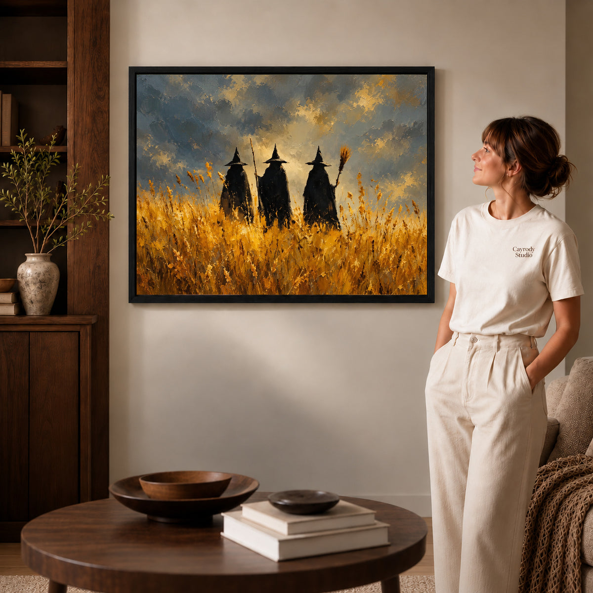 golden meadow witches canvas art shown in the black frame option against a softly lit wall.