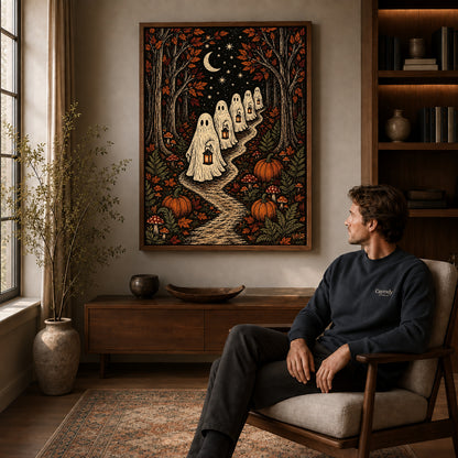 moonlit ghost lanterns canvas art in a walnut frame above a console beside a seated man.