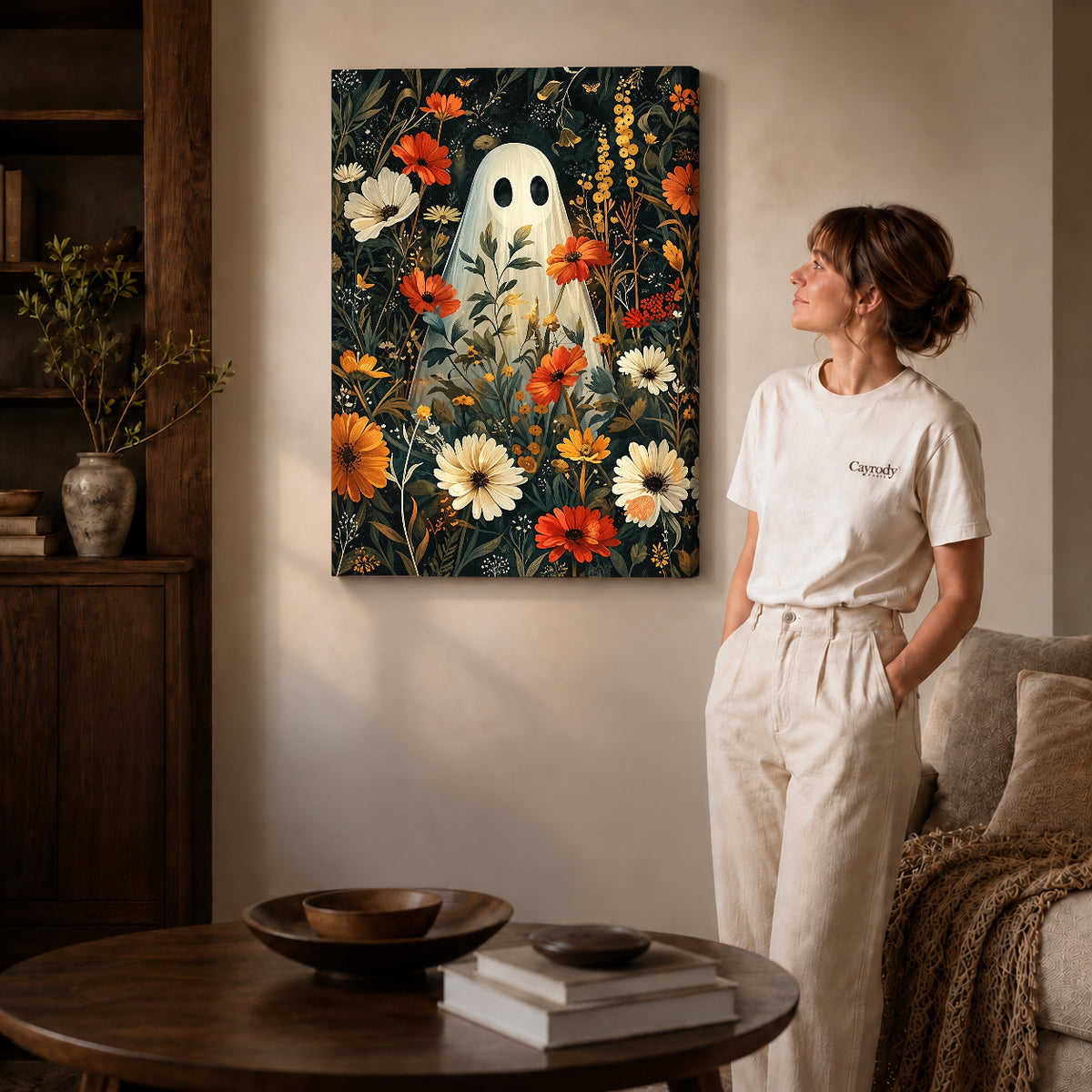 botanical ghost garden canvas art on gallery-wrapped canvas with natural edge shading beside a standing woman.