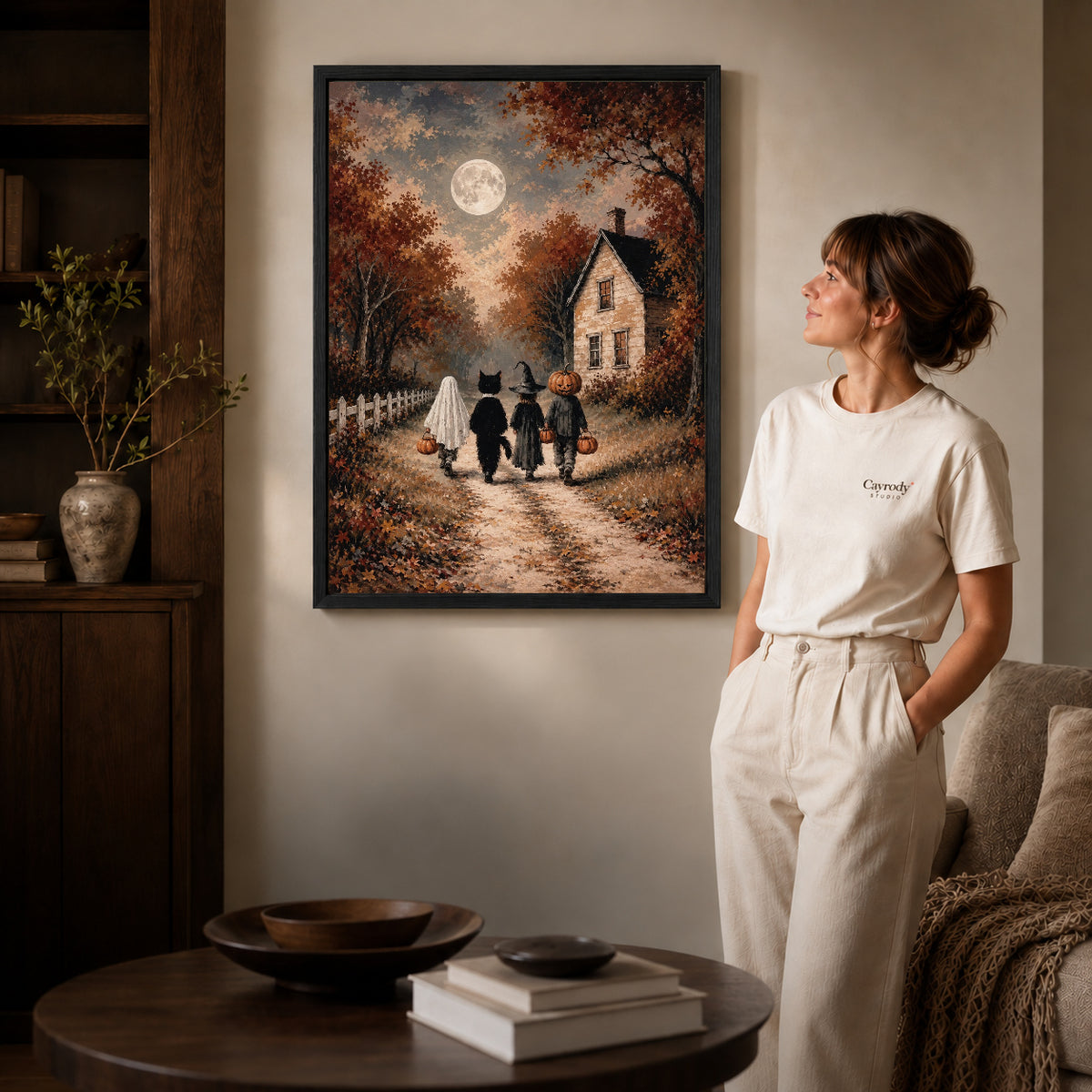moonlit costume walk canvas art shown in the black frame option against a softly lit wall.