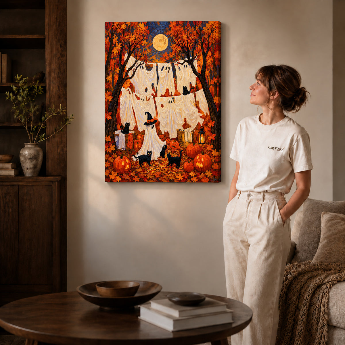autumn ghost laundry canvas art on gallery-wrapped canvas with natural edge shading beside a standing woman.