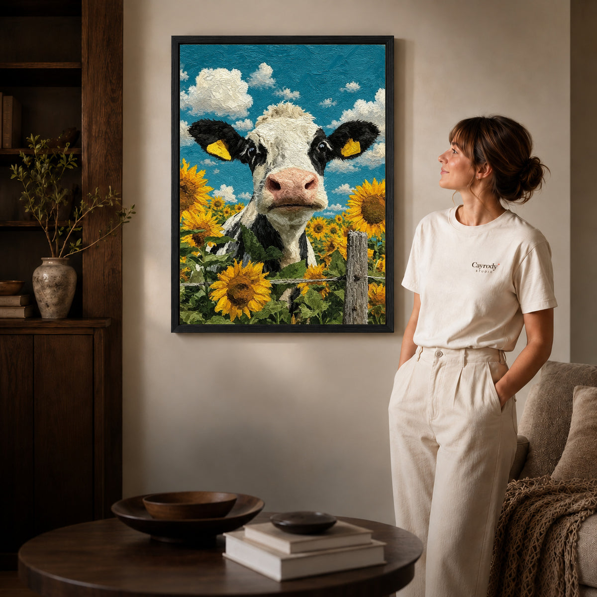 sunflower cow portrait canvas art shown in the black frame option against a softly lit wall.