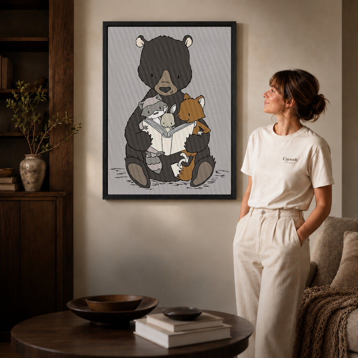 woodland storytime friends canvas art shown in the black frame option against a softly lit wall.