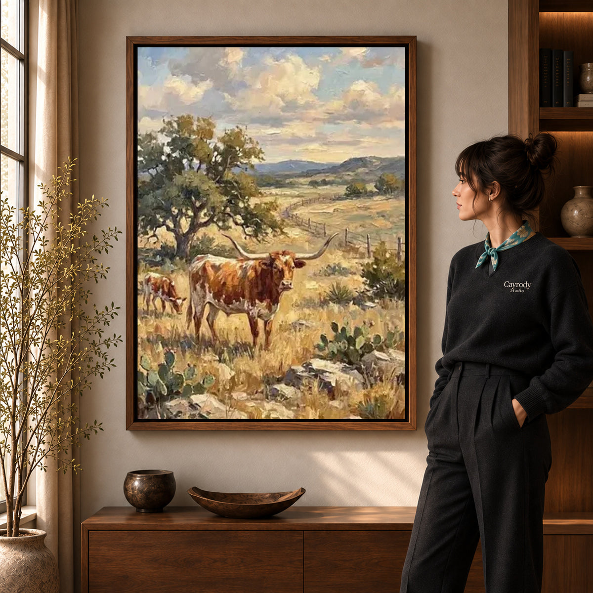 golden longhorn pasture canvas art shown in the walnut frame option within a warm living room.