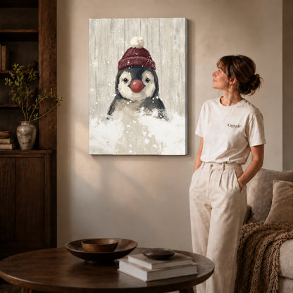 snowy penguin companion canvas art on gallery-wrapped canvas with natural edge shading beside a standing woman.