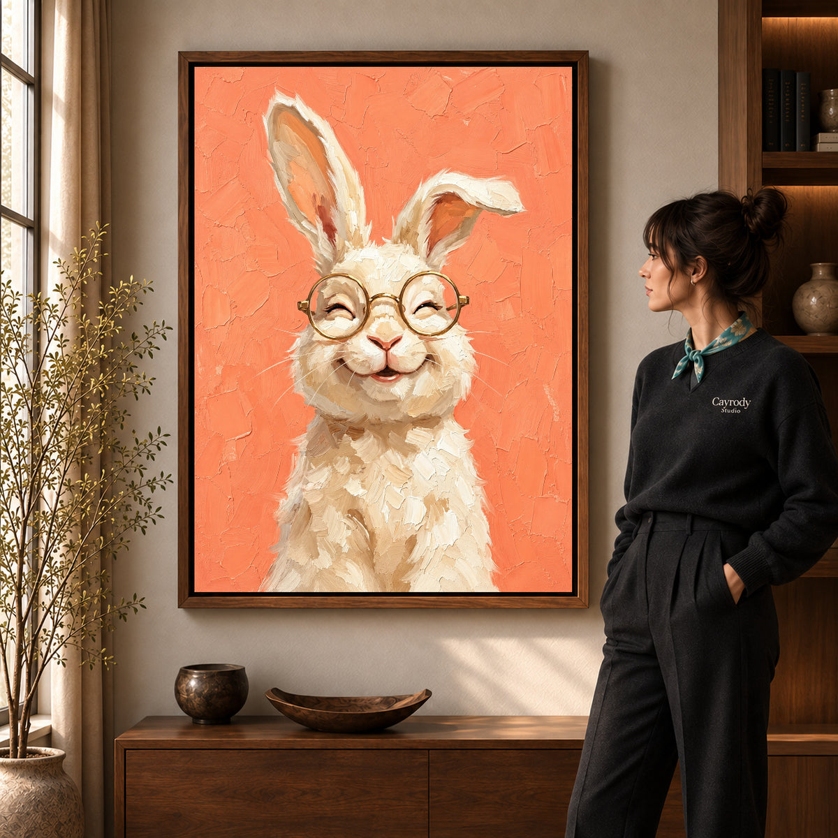 laughing rabbit portrait canvas art shown in the walnut frame option within a warm living room.