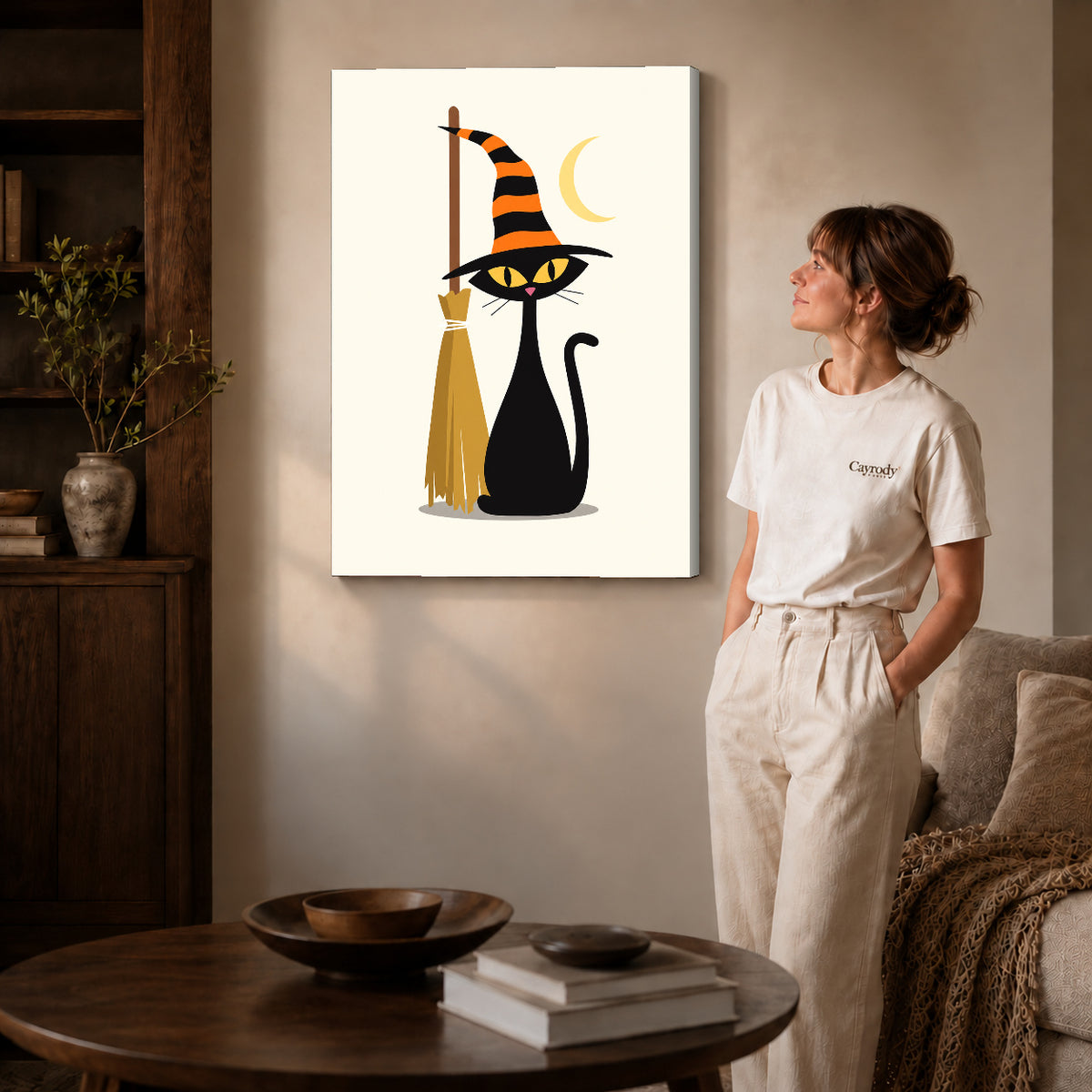 striped hat cat canvas art on gallery-wrapped canvas with natural edge shading beside a standing woman.