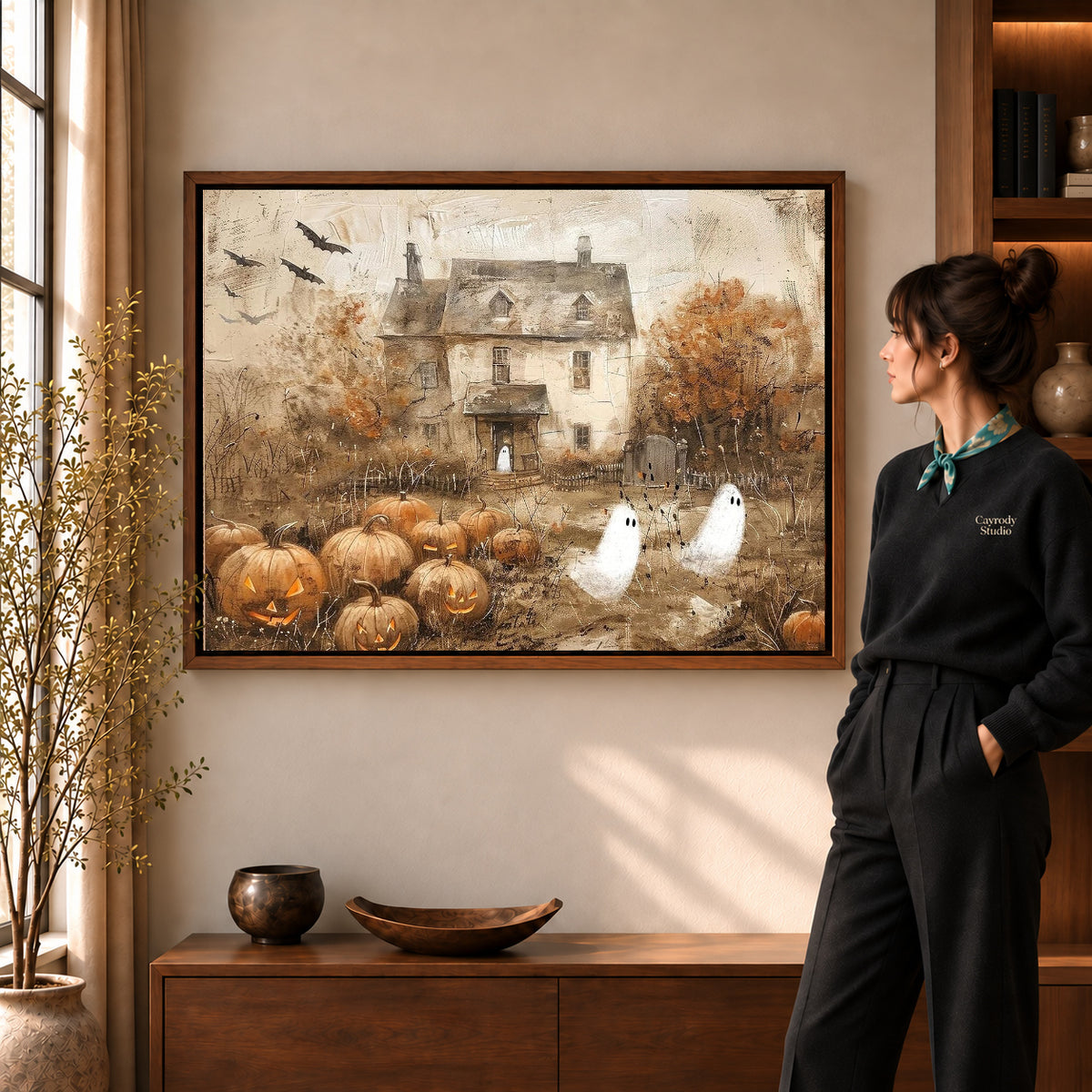 vintage ghost cottage canvas art shown in the walnut frame option within a warm living room.