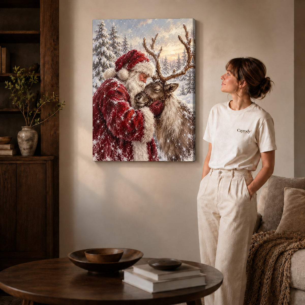 santa reindeer embrace canvas art on gallery-wrapped canvas with natural edge shading beside a standing woman.