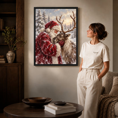 santa reindeer embrace canvas art shown in the black frame option against a softly lit wall.