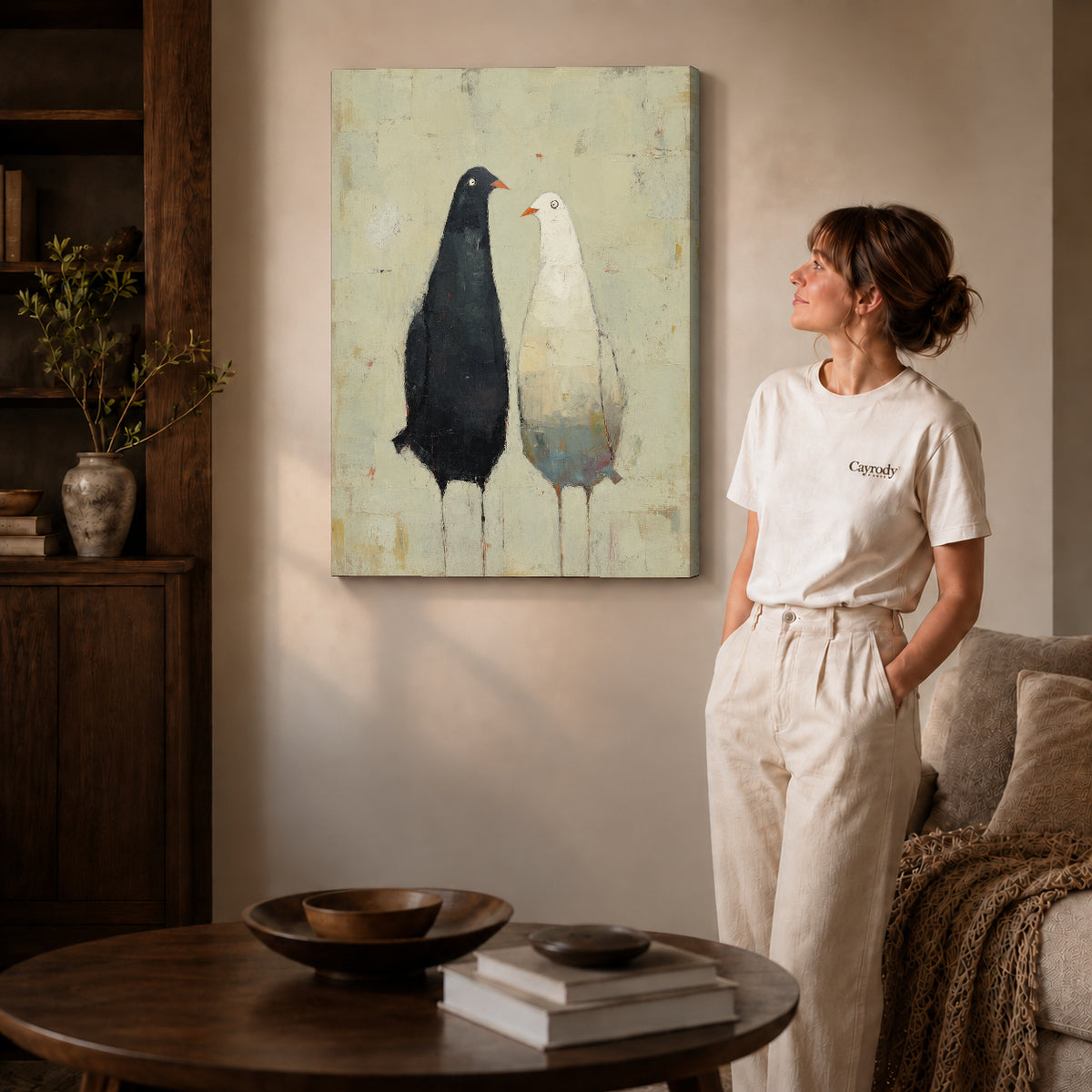 quiet bird companions canvas art on gallery-wrapped canvas with natural edge shading beside a standing woman.