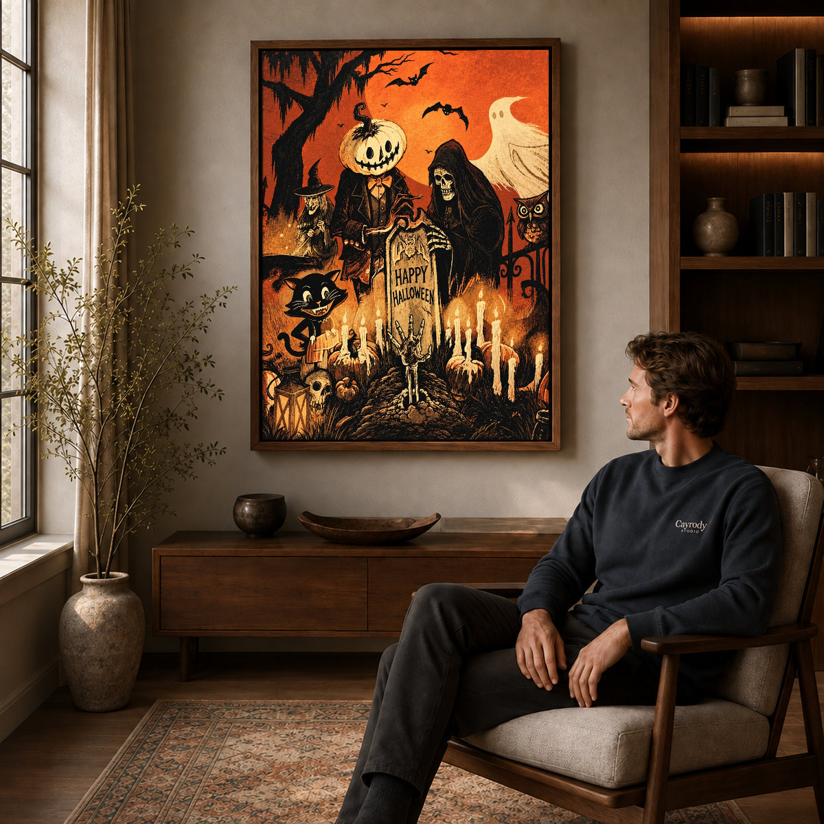 vintage halloween party canvas art in a walnut frame above a console beside a seated man.
