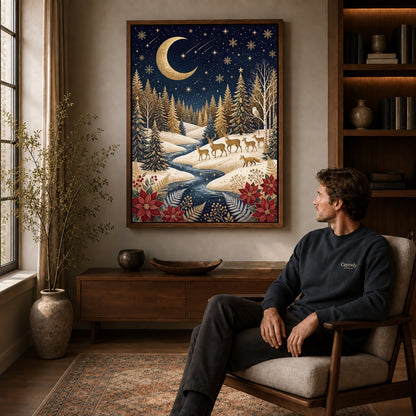 golden winter forest canvas art in a walnut frame above a console beside a seated man.