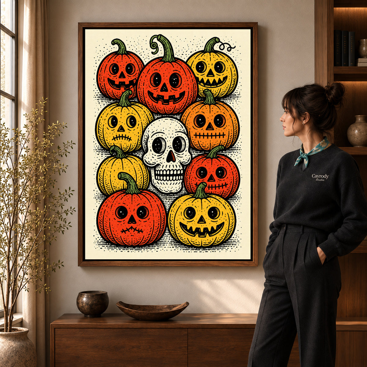 vintage pumpkin gathering canvas art in a walnut frame beside a standing woman and wooden console.
