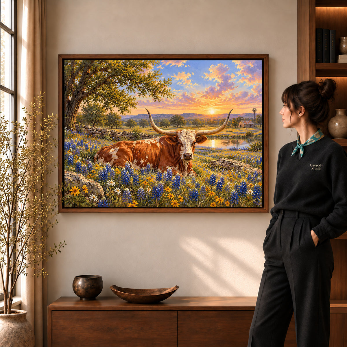sunset longhorn meadow canvas art shown in the walnut frame option within a warm living room.