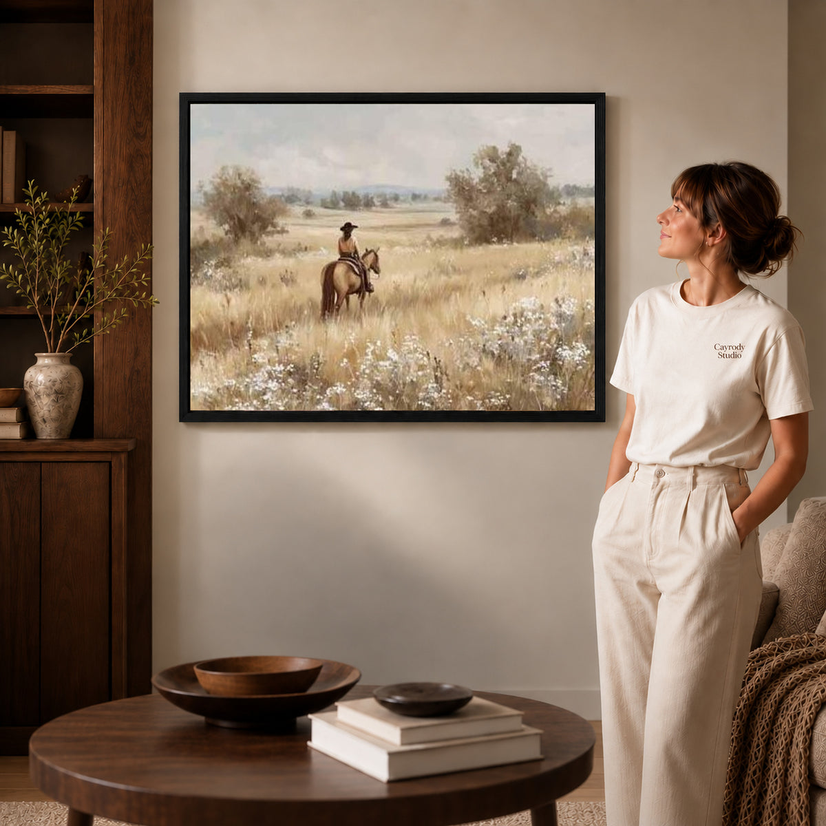 quiet prairie rider canvas art shown in the black frame option against a softly lit wall.