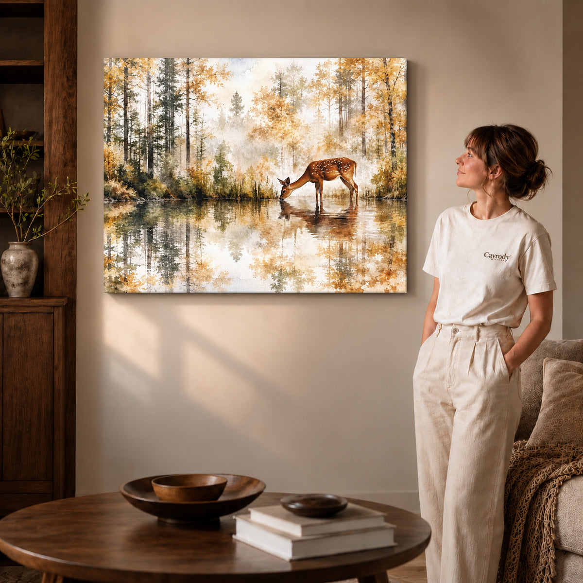 quiet woodland deer canvas art on gallery-wrapped canvas with visible edge depth beside a standing woman.