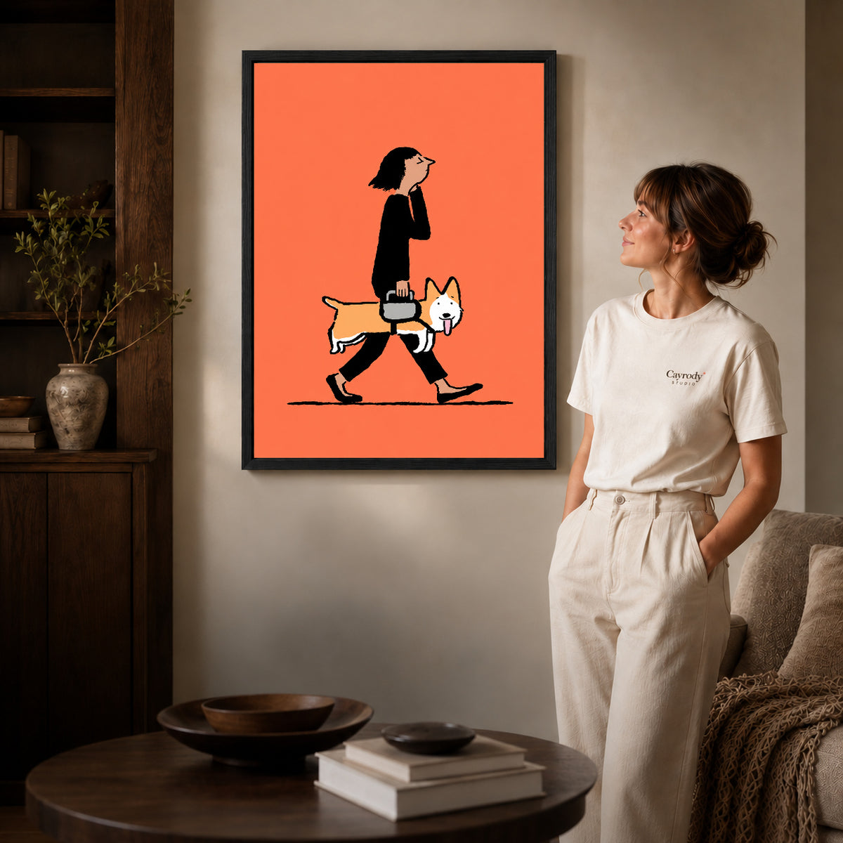 walking corgi companion canvas art shown in the black frame option against a softly lit wall.