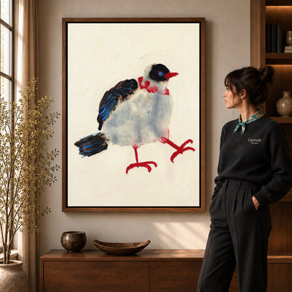 playful stepping bird canvas art shown in the walnut frame option within a warm living room.