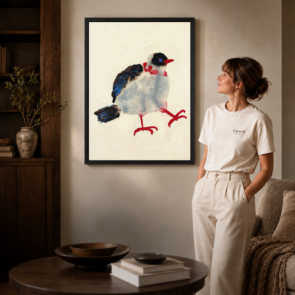 playful stepping bird canvas art shown in the black frame option against a softly lit wall.