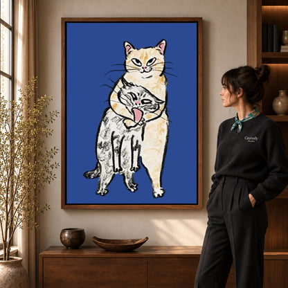 curious cat companions canvas art in a walnut frame beside a standing woman and wooden console.