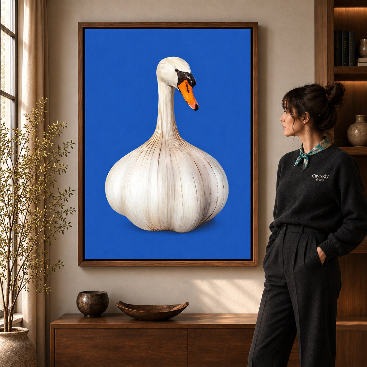 whimsical garlic swan canvas art shown in the walnut frame option within a warm living room.