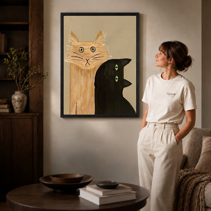 expressive cat gathering canvas art shown in the black frame option against a softly lit wall.