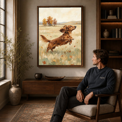 playful dachshund leap canvas art in a walnut frame above a console beside a seated man.