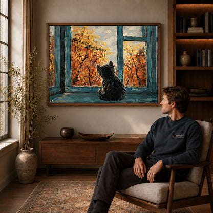 autumn window cat canvas art in a walnut frame above a console beside a seated man.