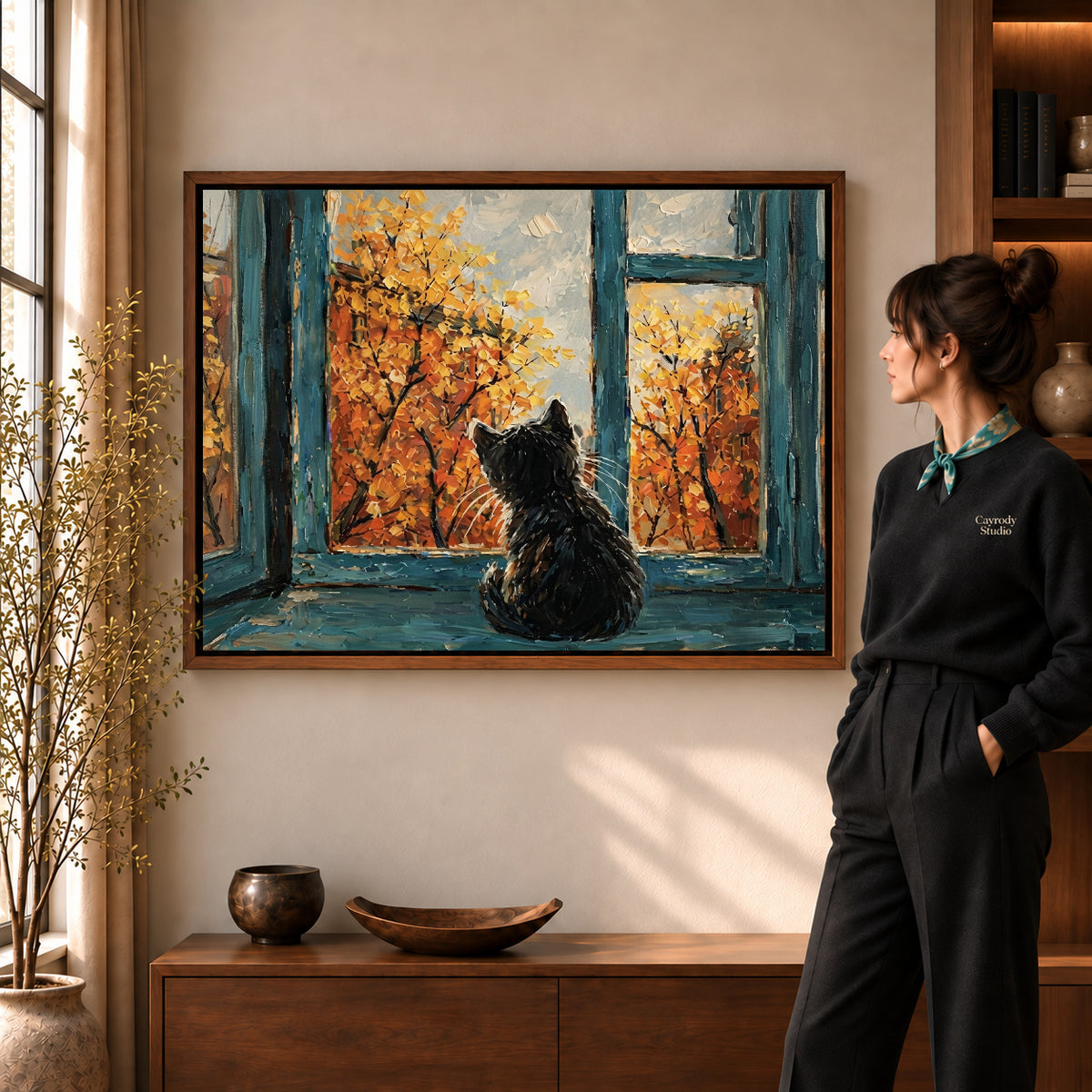 autumn window cat canvas art shown in the walnut frame option within a warm living room.