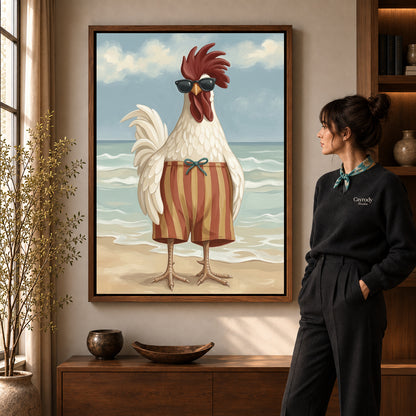 sunny beach rooster canvas art in a walnut frame beside a standing woman and wooden console.