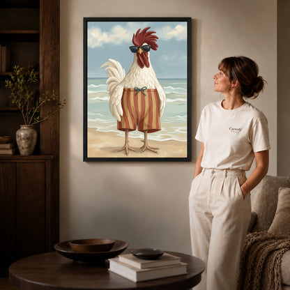sunny beach rooster canvas art in a black frame beside a woman and round wooden table.