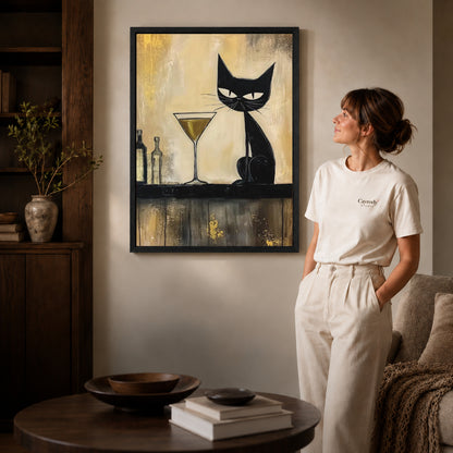midnight martini cat canvas art shown in the black frame option against a softly lit wall.