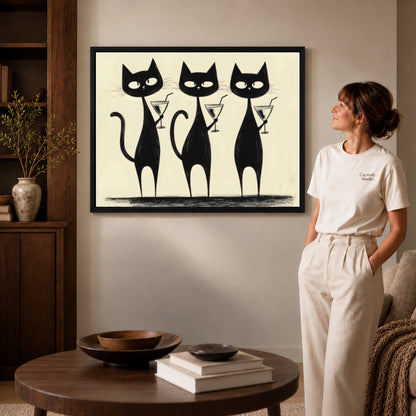 cocktail cat trio canvas art shown in the black frame option against a softly lit wall.