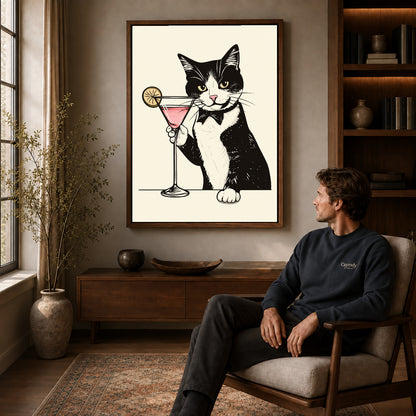 tuxedo cocktail cat canvas art in a walnut frame above a console beside a seated man.
